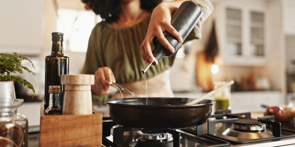 a woman cooking, reflecting Simply Stocked’s mission to simplify mealtime for busy families with ease.