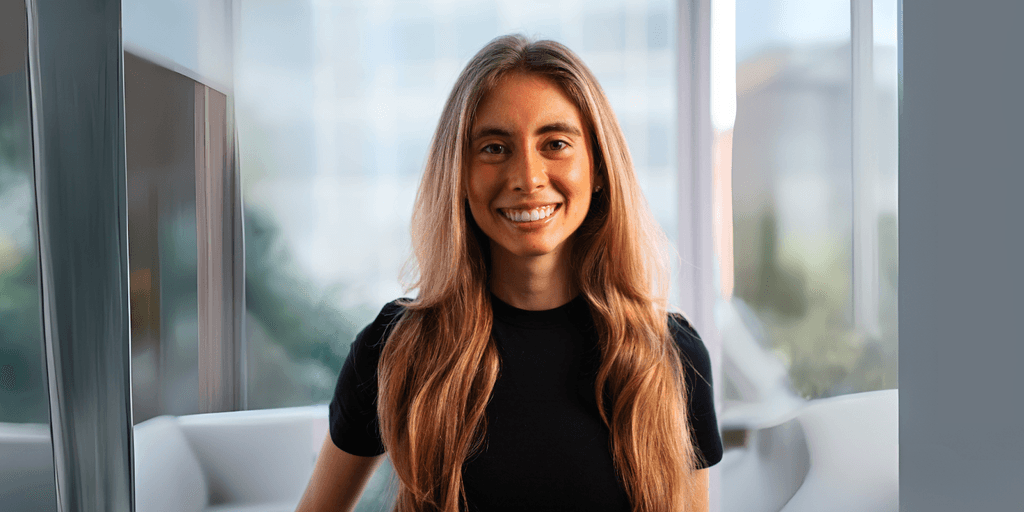 Nicole Grossmann smiling indoors, representing women in AI and her impact on consumer-focused tech innovation.
