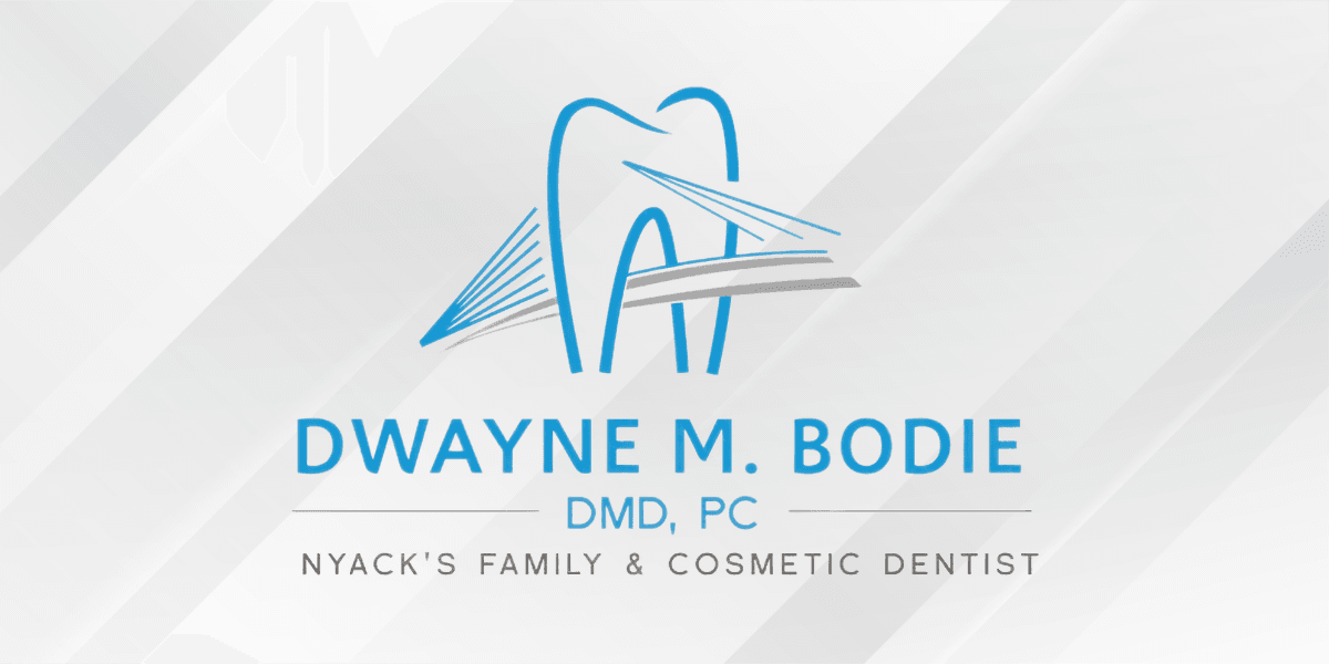 Logo for Dwayne M. Bodie, DMD, PC, featuring a dental motif and text.