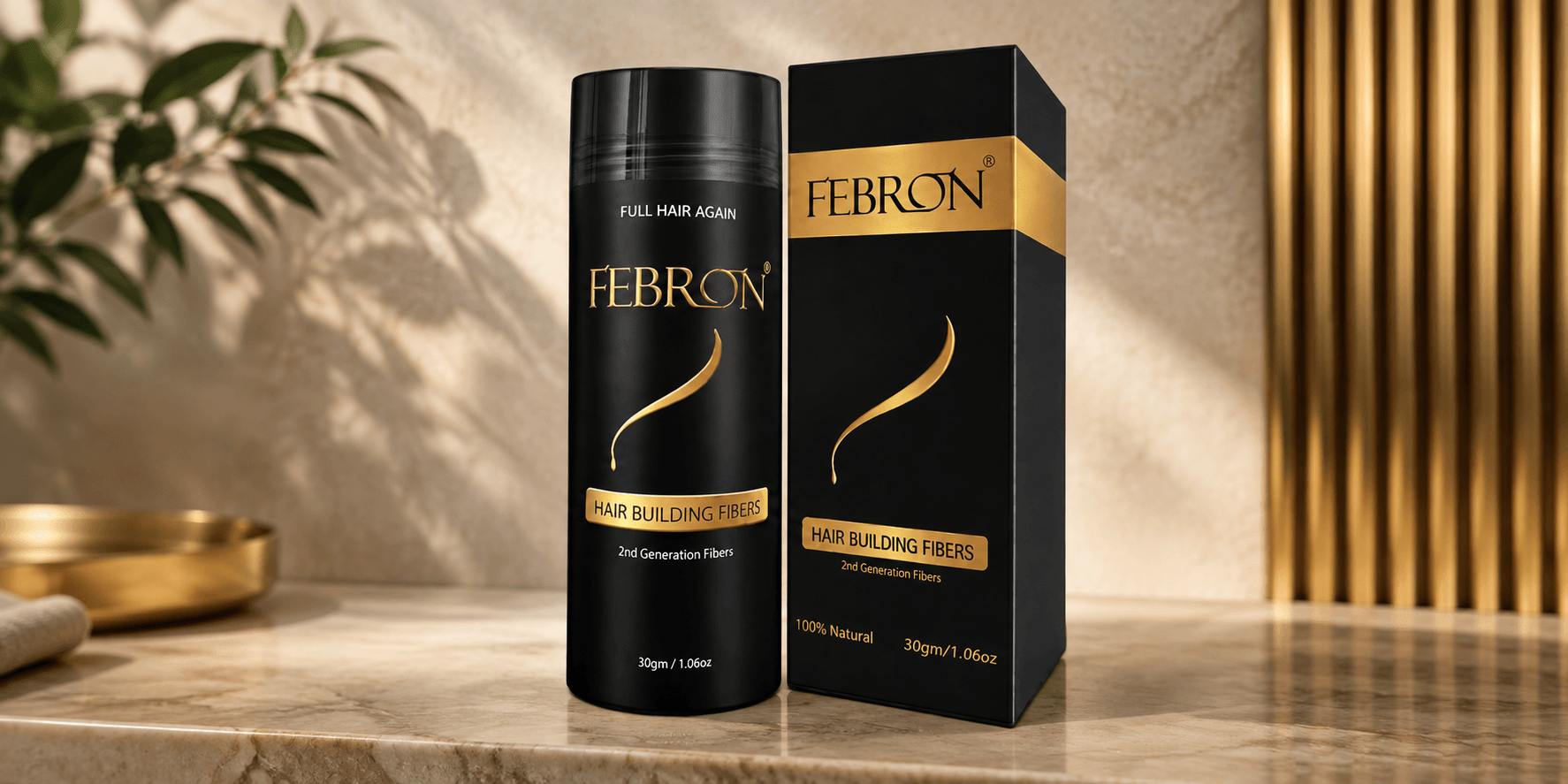 Bottle of Febron Hair Building Fibers on a marble surface with a plant background