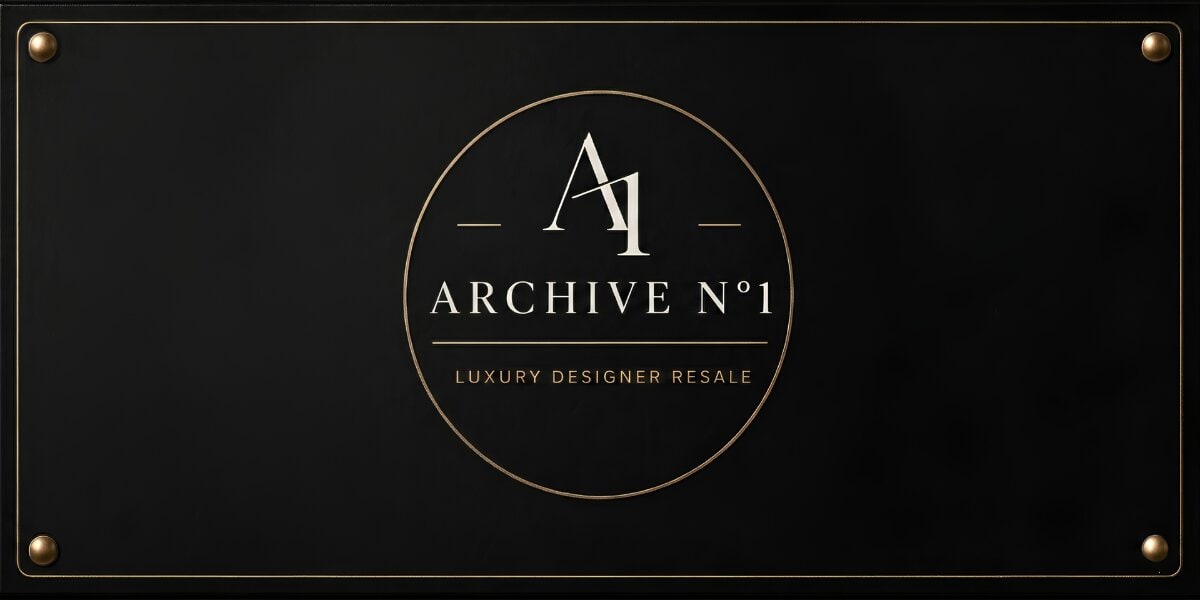 A black sign features a gold-bordered circle with "A1 ARCHIVE N°1" inside, and "Luxury Designer Resale" below, conveying elegance and exclusivity.