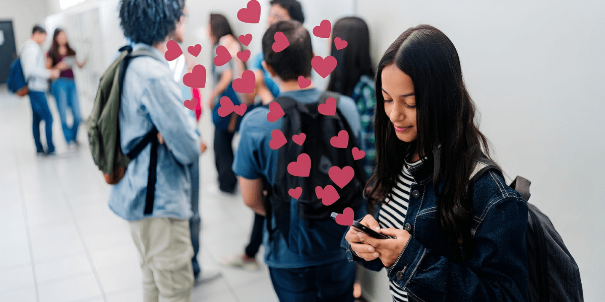 Person using a smartphone while others socialize nearby, illustrating modern online dating.