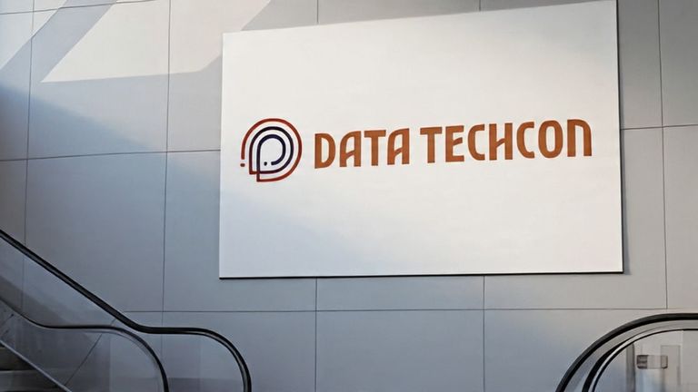 Logo of Data Techcon displayed on a wall, representing a transformative initiative empowering underrepresented communities through AI and data.
