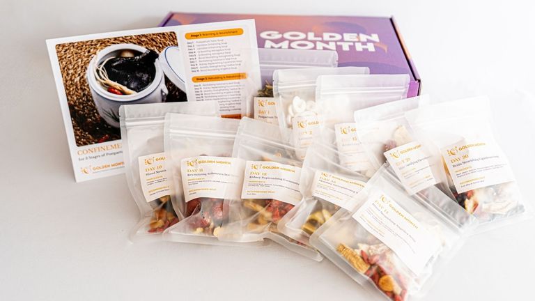 Golden Month postpartum nourishment bundles with herbal soups, teas, and bath packs for modern mothers.