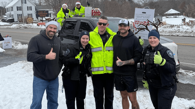 Jason Duffy and local officers participate in a community event supporting the Toys for Tots campaign.