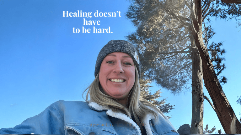 Smiling woman outdoors under blue sky with trees, text reads “Healing doesn’t have to be hard.” promoting natural wellness.