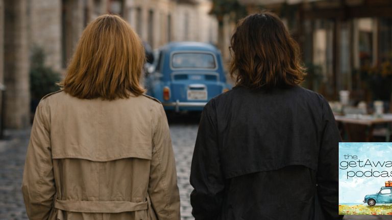 Two people walk through a charming European street, embodying The getAwayZ’s focus on real-life, immersive travel experiences.