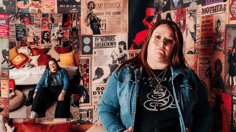 Megan Boerner, holistic coach at Out Of The Woods Coaching, posed in her music-themed room surrounded by vintage concert posters