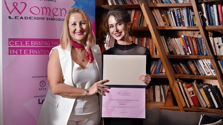 "Veronica Hamilton with award at the Women Leadership Symposium, celebrating her achievements in tech, leadership, and global innovation."