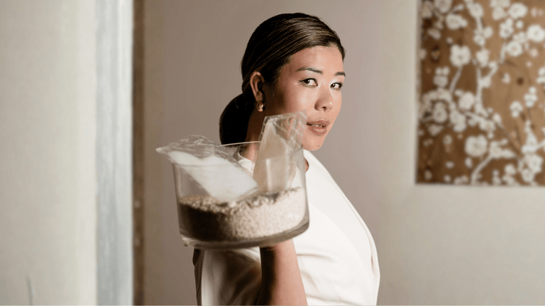 Stella Ungphongphan holding a container of rice, symbolizing her brand Rice Remedy, blending ancestral wisdom with modern wellness.