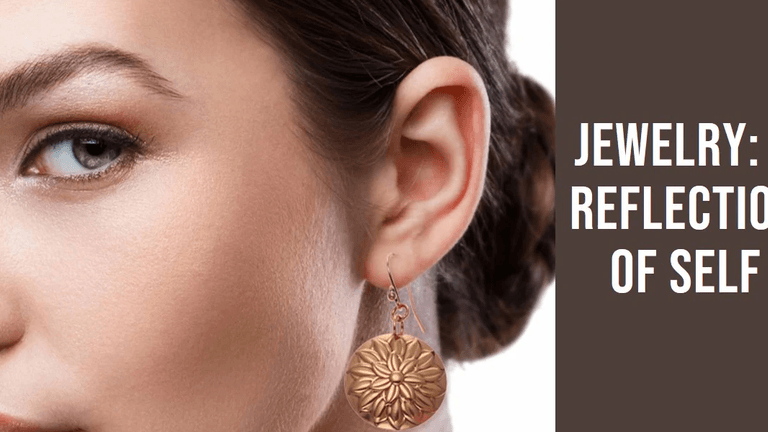 "Close-up of a woman wearing elegant gold floral earrings, showcasing a modern style."