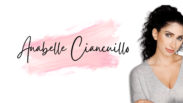 Anabelle Ciancuillo poses against a pink brushstroke background, showcasing her creative energy and passion for storytelling in Hollywood.
