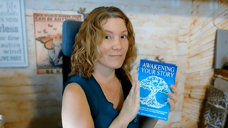 Marie-Josée Borduas holding *Awakening Your Story*, promoting her Story Alchemy movement to help others rewrite their narratives.