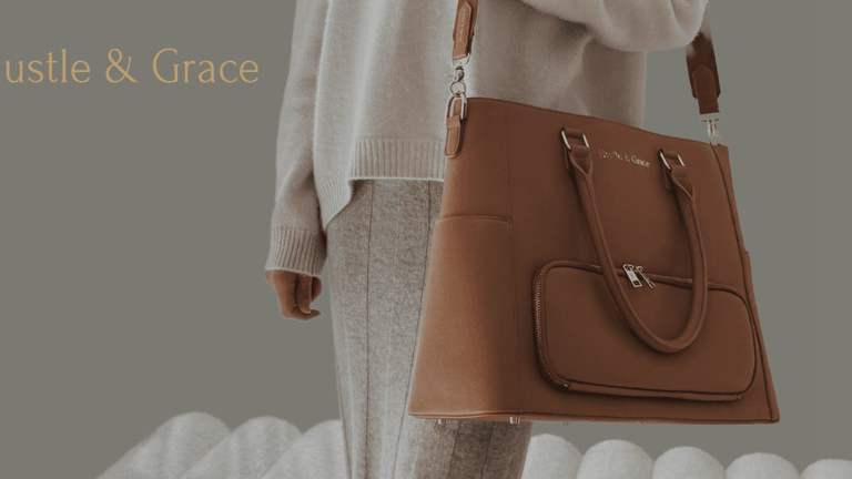 Person carrying tan vegan leather tote bag from Hustle & Grace, showcasing elegant and functional design