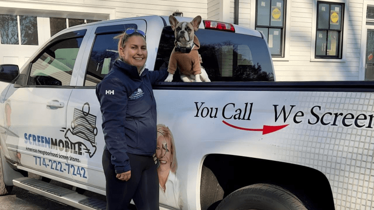 "Britney Nelson with her dog and ScreenMobile truck, offering custom outdoor living solutions in South Shore, MA."