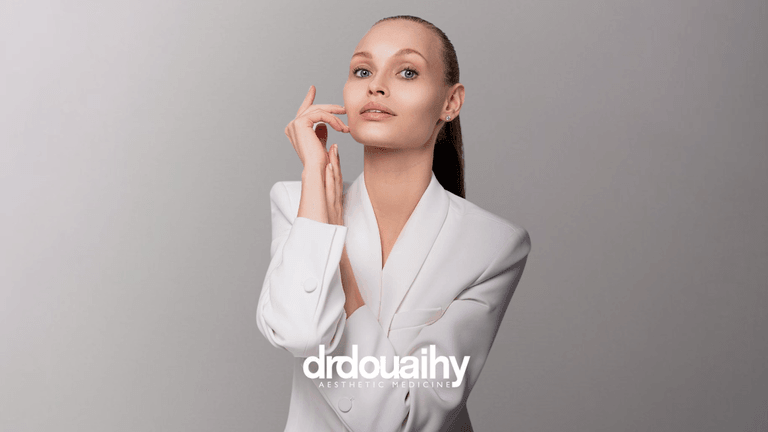 Image 1: Dr. Douaihy showcasing professional aesthetic expertise in a refined, natural pose.