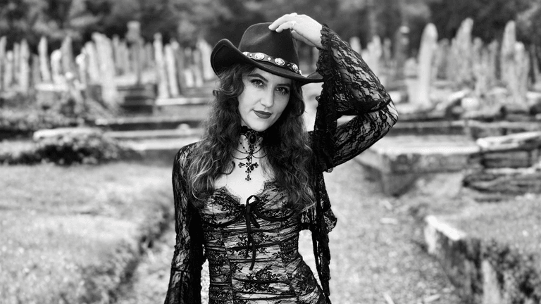 "Alice Ashe, rising Manx music star, blends rock, folk, and pop to create powerful storytelling through her debut single."
