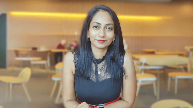 Poornima L Nathan, founder of Everse Pty. Ltd., poses confidently in a professional setting. Her company specializes in integrating AI and automation into legacy systems, helping businesses innovate without disrupting their operations. Everse focuses on delivering tailored, sustainable solutions for enterprises, ensuring the ethical and practical adoption of advanced technologies.