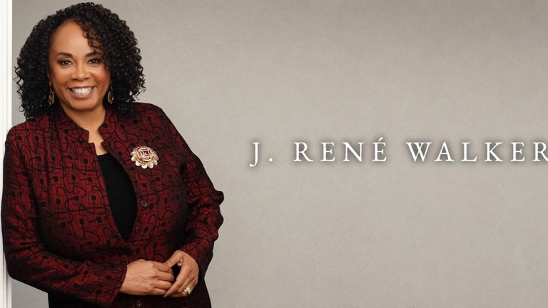 J. René Walker smiles in a burgundy jacket beside her name on a neutral background.