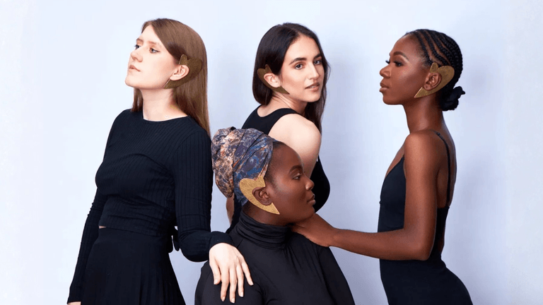"Four models wearing bold, handmade African jewelry by Quemsa Afrique, showcasing cultural heritage and global fashion fusion."