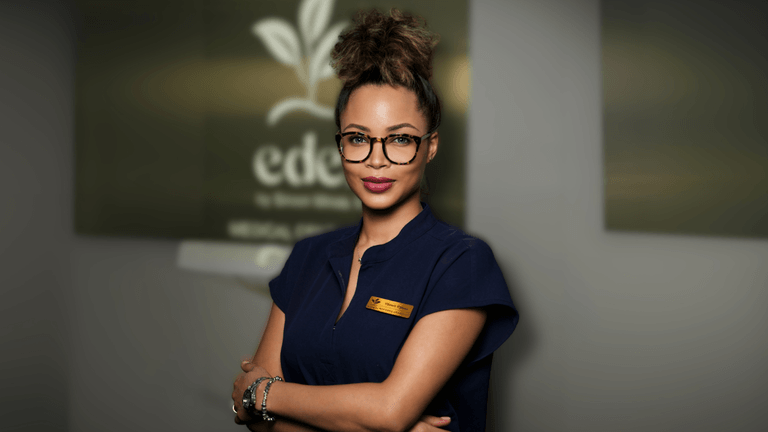 Dr. Siroon Minas, a renowned plastic surgeon and skincare entrepreneur, poses confidently at EDEN Medical Center, showcasing her unique approach to beauty that emphasizes empowerment, individuality, and holistic well-being.