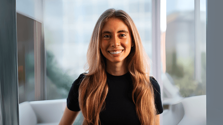 Nicole Grossmann smiling indoors, representing women in AI and her impact on consumer-focused tech innovation.