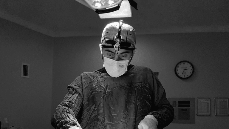 "Dr. Mehmet Fatih Okyay performing gender-affirming surgery with precision, offering compassionate care and expertise in facial feminization surgery."