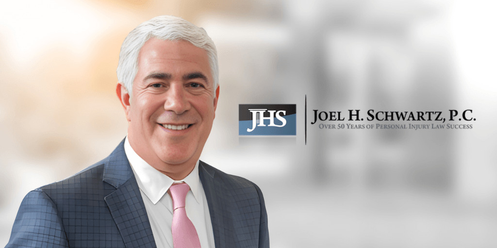 Professional headshot of a man in a suit with a logo for a law firm