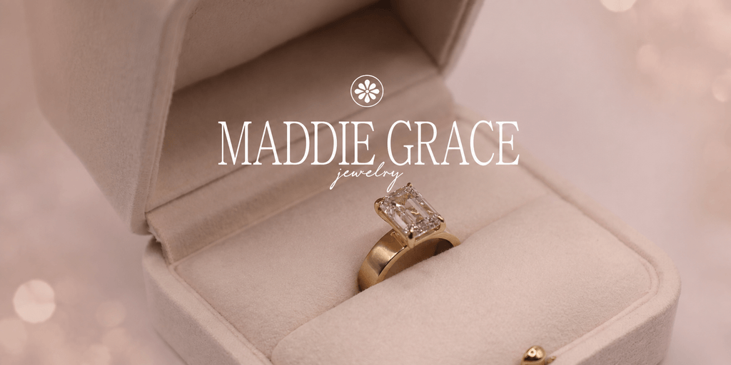 A golden engagement ring with a rectangular diamond in a velvet box