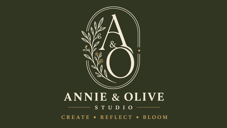 Logo for Annie & Olive Studio with floral elements and tagline "Create Reflect Bloom"