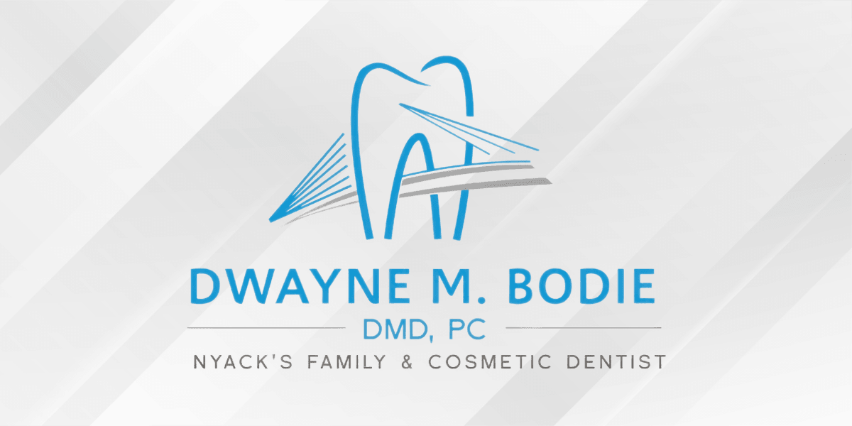 Logo for Dwayne M. Bodie, DMD, PC, featuring a dental motif and text.