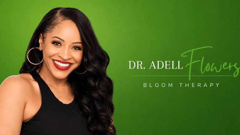 Smiling woman with long hair on a green background promoting Bloom Therapy.