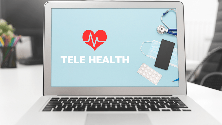 Laptop displaying "TELE HEALTH" with a stethoscope, phone, mask, and pills around it