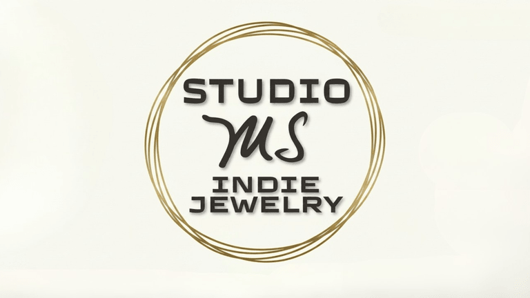 Logo for Studio MS Indie Jewelry, featuring elegant typography and a circular design