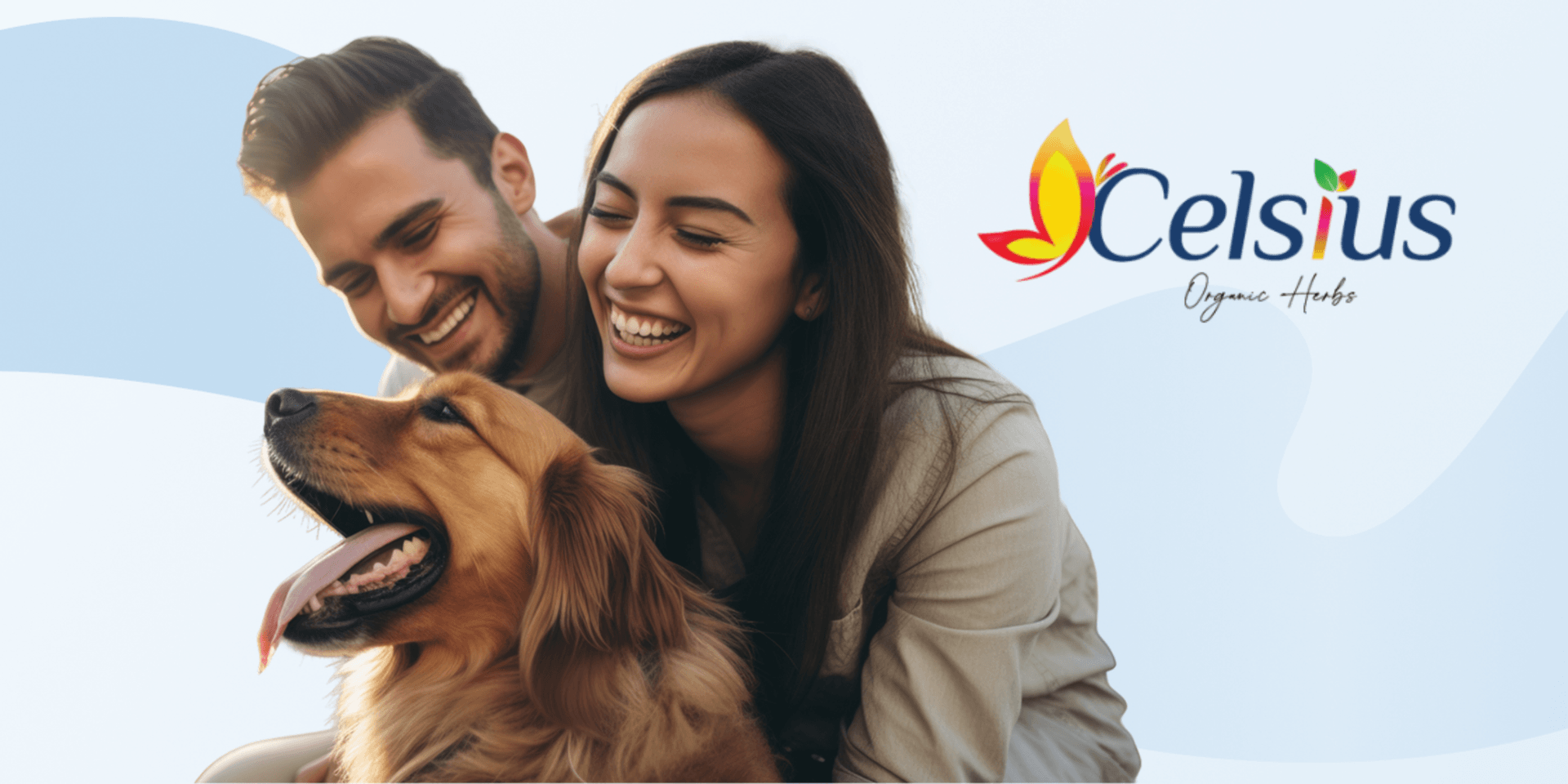 A happy couple sits with a golden retriever against a soft blue background