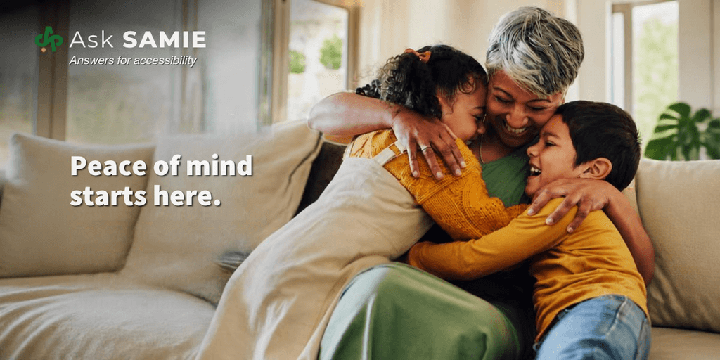 A woman and two children share a warm hug on a couch