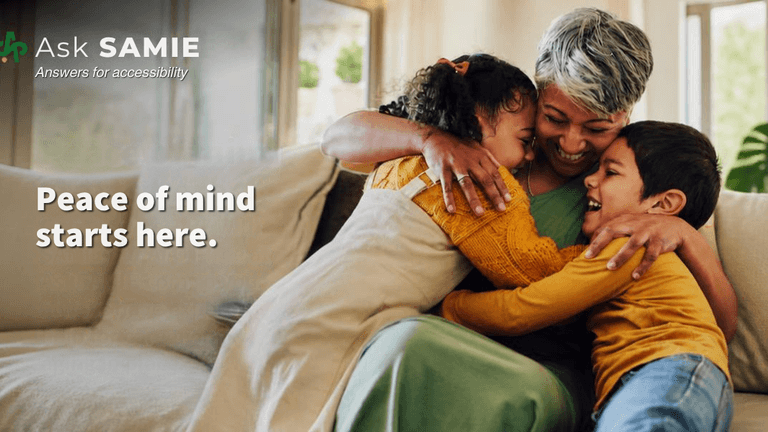 A woman and two children share a warm hug on a couch
