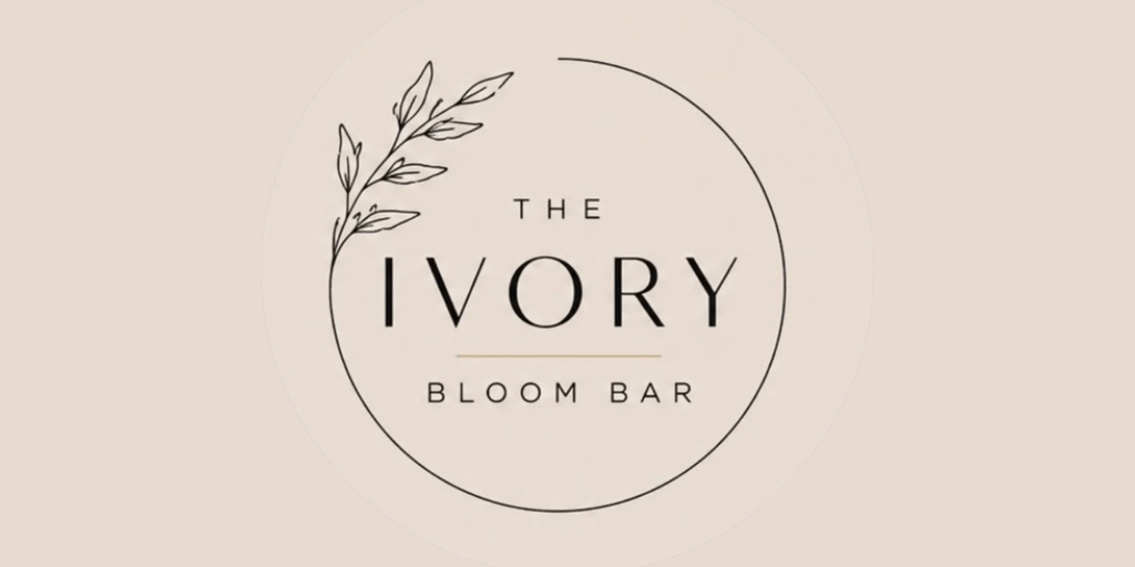 Logo for The Ivory Bloom Bar featuring elegant typography and leafy accent design