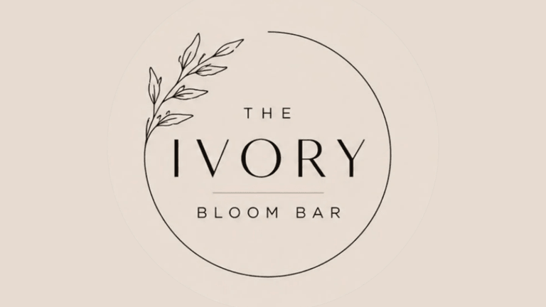 Logo for The Ivory Bloom Bar featuring elegant typography and leafy accent design