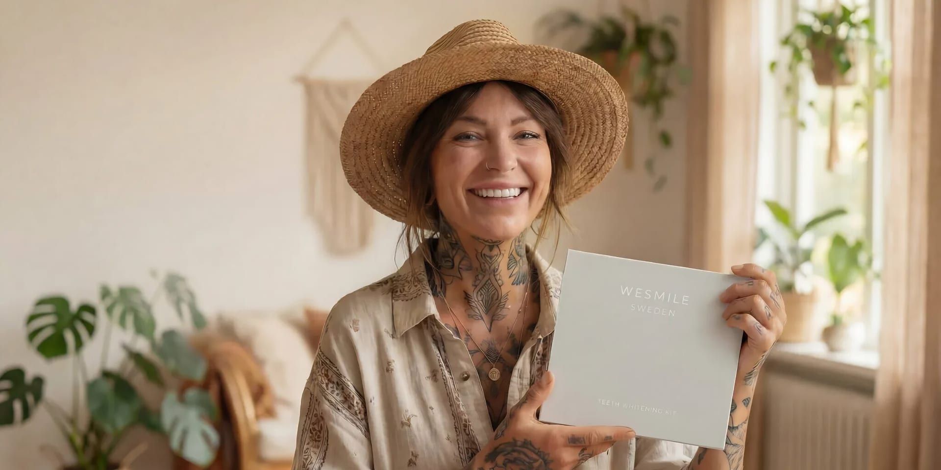 A tattooed woman holds a white box, representing a Swedish brand in the evolving teeth whitening market.