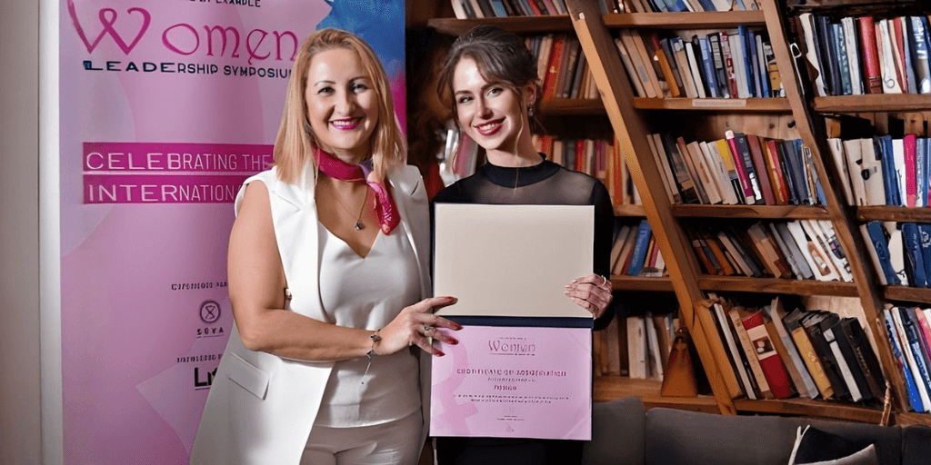 "Veronica Hamilton with award at the Women Leadership Symposium, celebrating her achievements in tech, leadership, and global innovation."