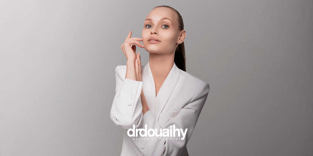 Image 1: Dr. Douaihy showcasing professional aesthetic expertise in a refined, natural pose.