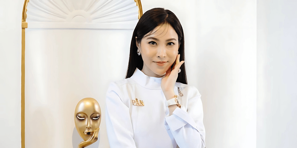 Dr. Laurel, founder and CEO of PAN Aesthetics Specialist Clinic, poses confidently in a white professional outfit, reflecting her leadership in Myanmar's aesthetic medicine. Her clinic is renowned for its commitment to ethical, high-quality treatments using internationally recognized products. Dr. Laurel's dedication to patient safety and education has positioned PAN Aesthetics as a trusted destination for advanced aesthetic services