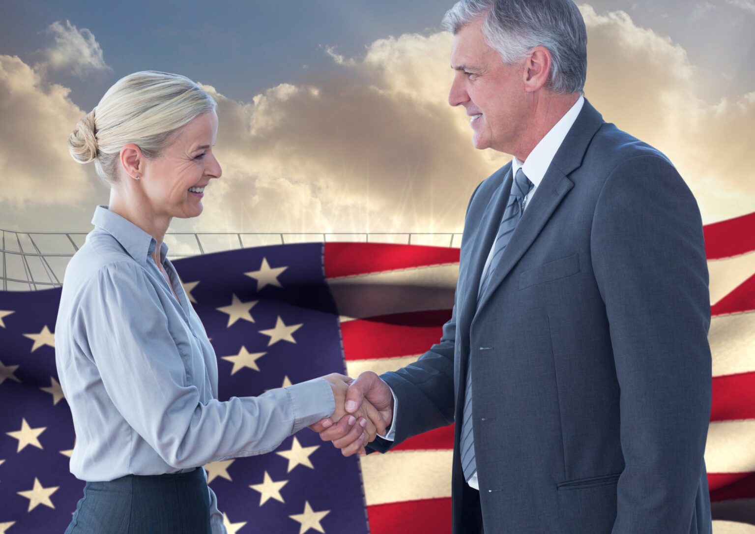 Business Executives Shaking Hands Against American Flag In Background