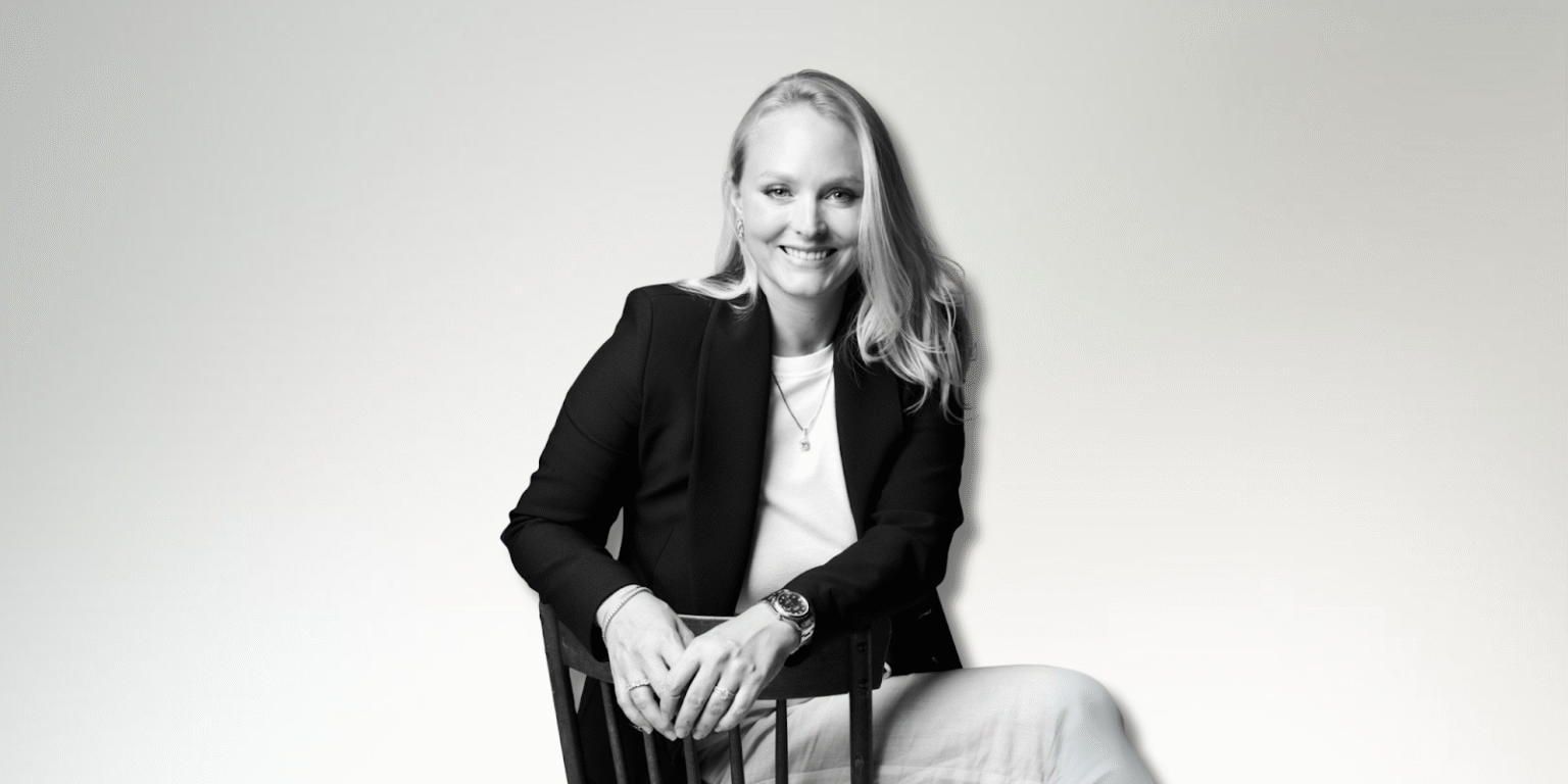 “She Buys the Diamond Now”: Empowering Women to Own Their Milestones Milena Dold, founder of IRALIS, confidently seated and smiling, embodies the empowerment and luxury of self-purchased diamonds, symbolizing independence, achievement, and a redefined approach to personal milestones in the jewelry industry.