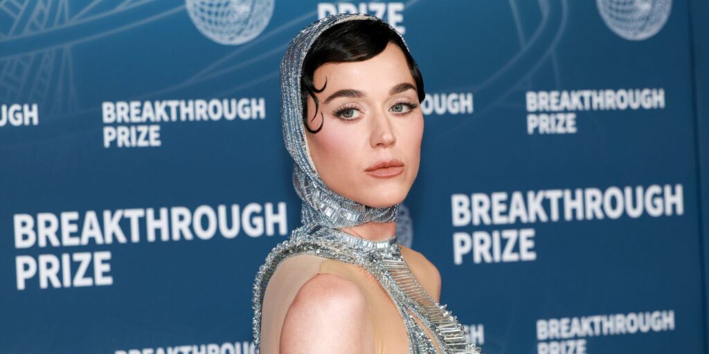 Katy perry stuns in daring galactic silver dress with bold