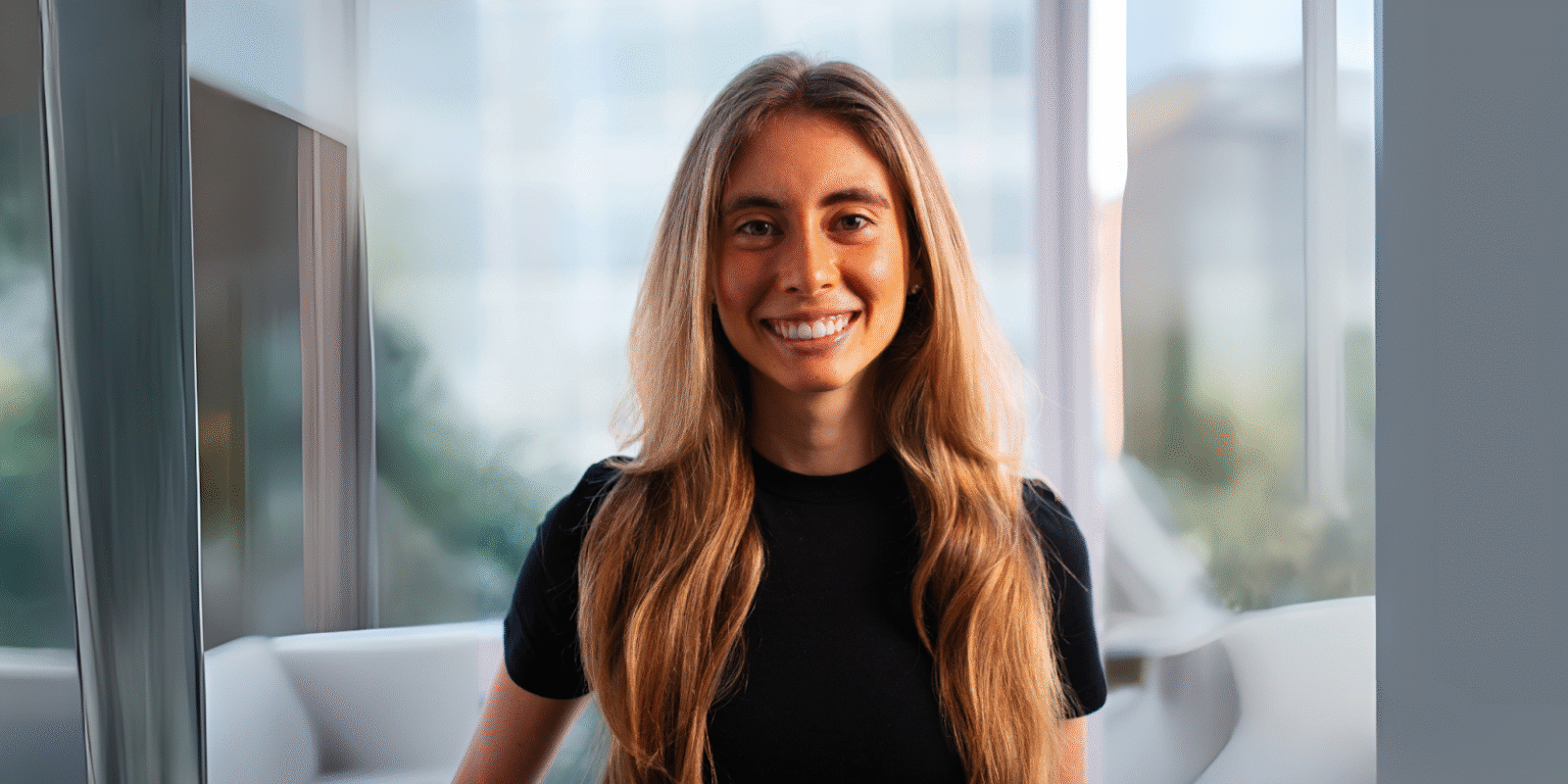 Nicole Grossmann smiling indoors, representing women in AI and her impact on consumer-focused tech innovation.