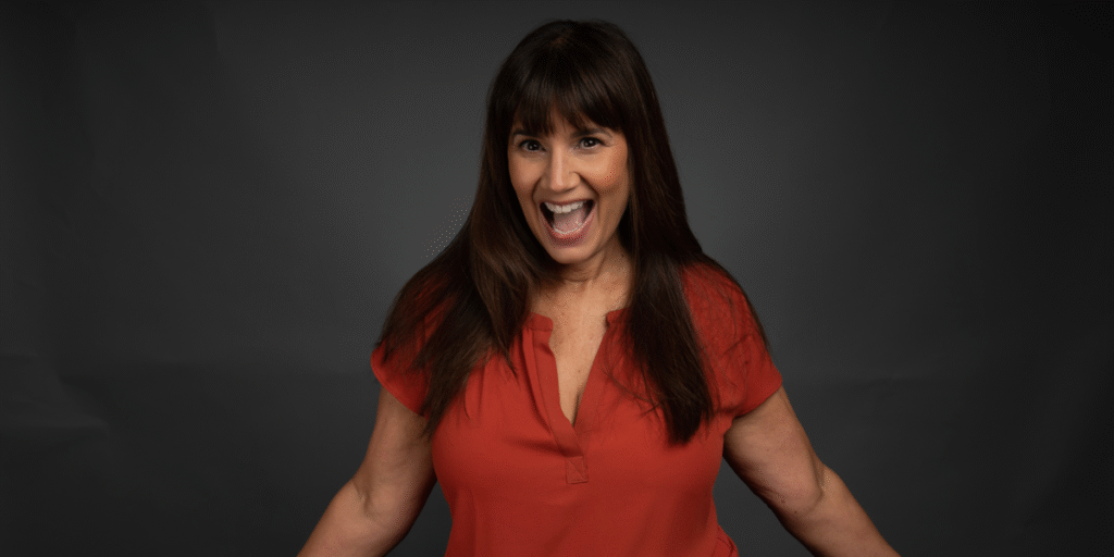 Mindy Acevedo, founder of Acting Over 50, coaching a woman to boost confidence and break age-related stereotypes, empowering women 50+ to shine authentically.