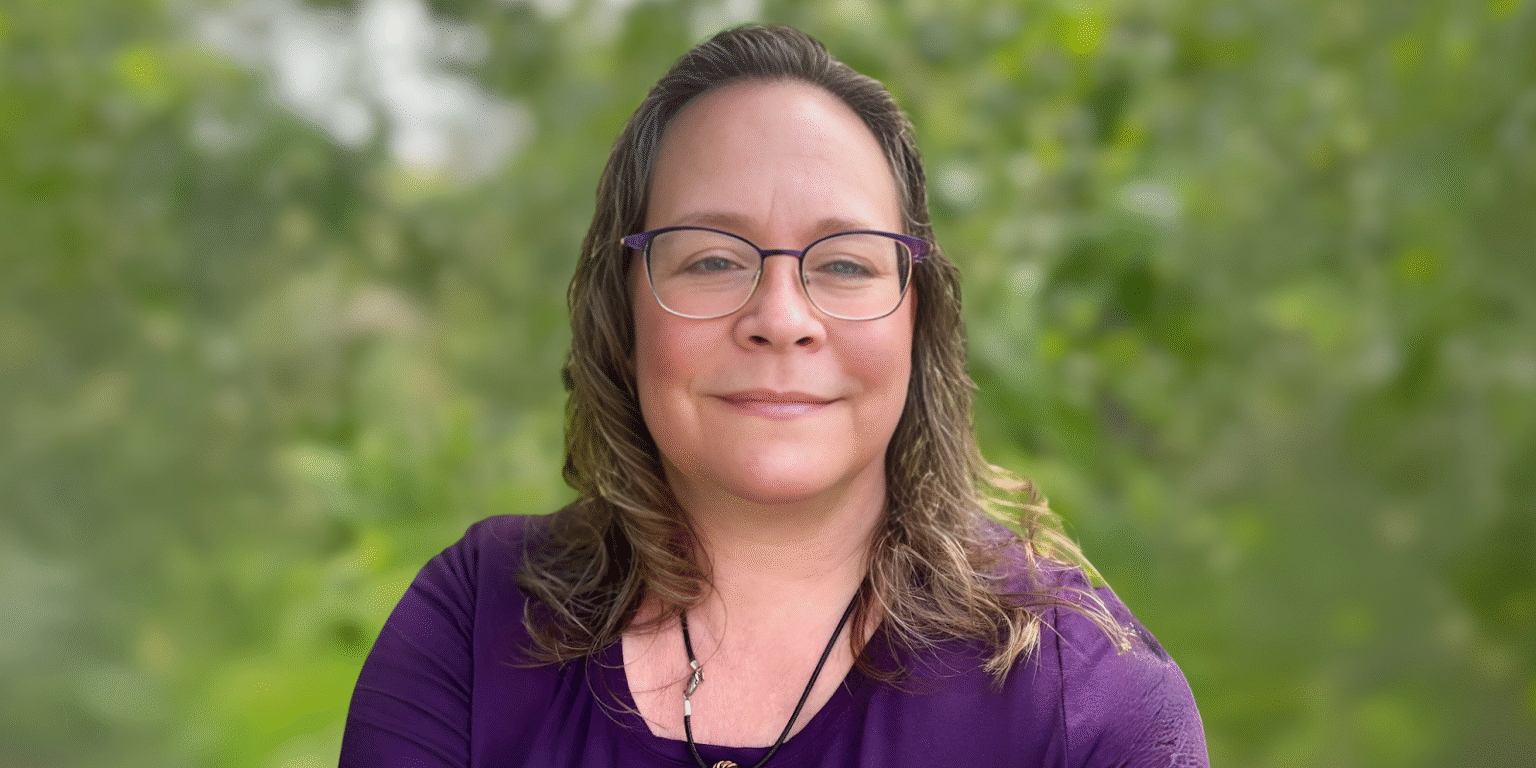 Kellie Winzinowich, a Certified Hypnotherapist and Aligned Embodiment Coach, guiding individuals through transformative healing and personal growth.