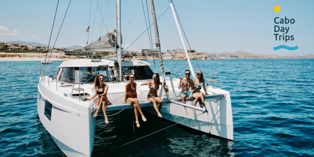 Cabo Day Trips: The Secret to Choosing Your Tours in Los Cabos "Group of friends enjoying a sailing adventure with Cabo Day Trips, reflecting the brand’s focus on personalized, exciting tours."